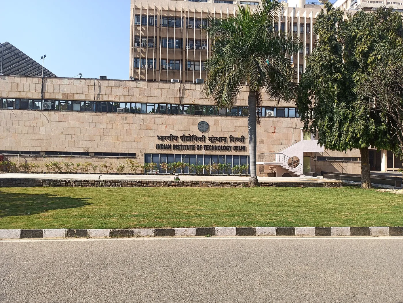 The front of the main building at IIT Delhi, with its name in Hindi and English